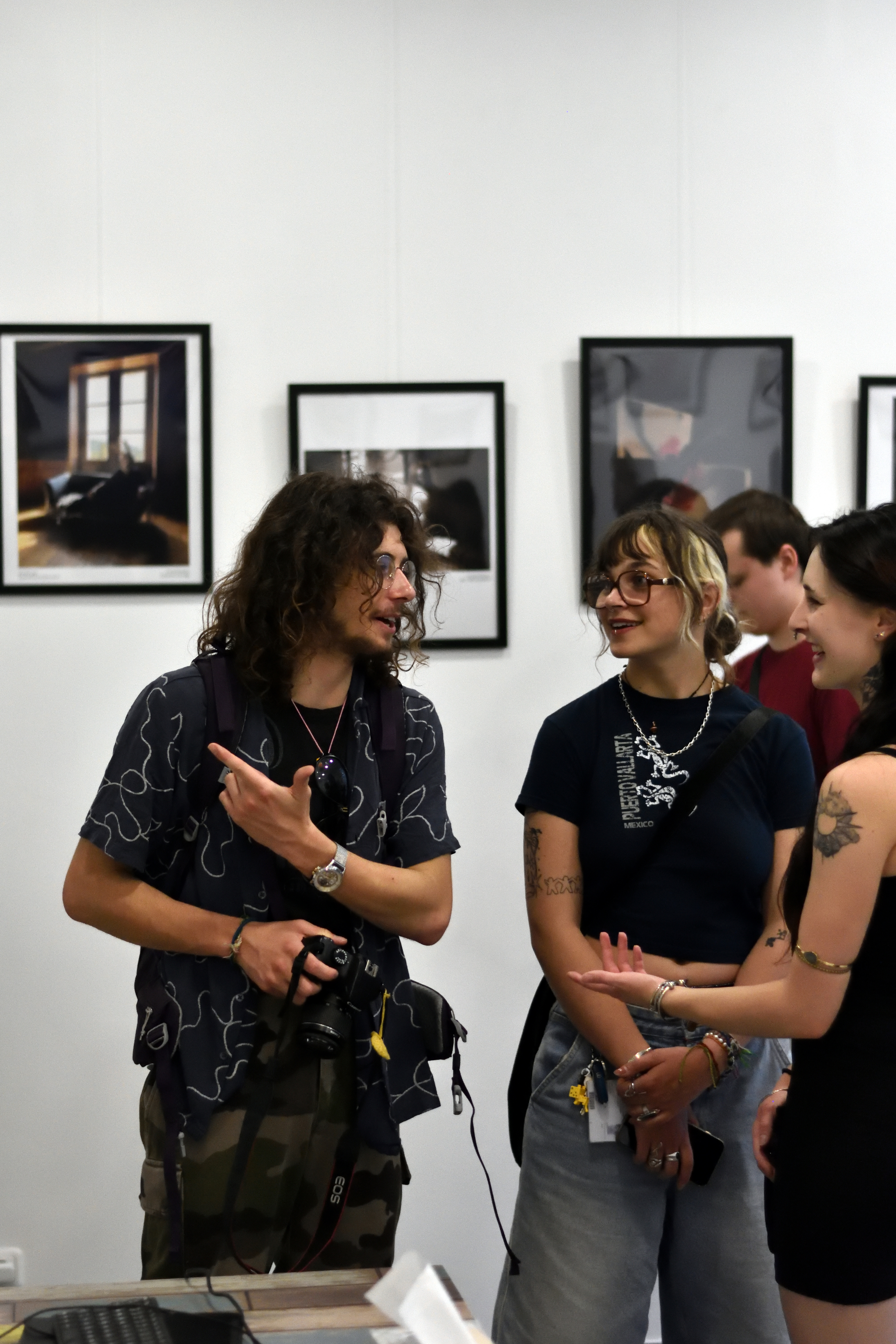 Visitors viewing artwork at The Names Gallery in Vienna